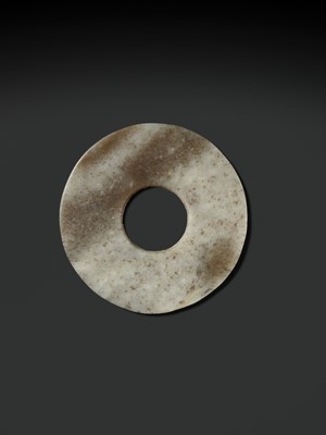 Lot 139 - A MOTTLED WHITE AND RUSSET JADE DISK, BI, QIJIA CULTURE