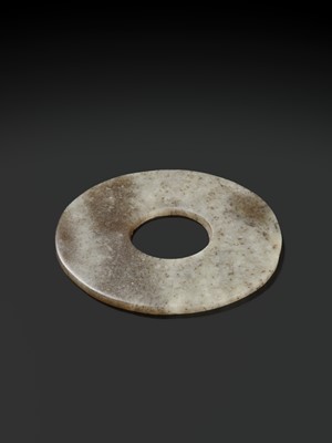 Lot 139 - A MOTTLED WHITE AND RUSSET JADE DISK, BI, QIJIA CULTURE