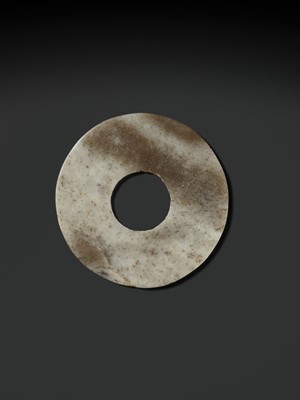 Lot 139 - A MOTTLED WHITE AND RUSSET JADE DISK, BI, QIJIA CULTURE