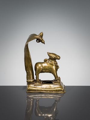 Lot 289 - A BRASS FIGURE OF NANDI CANOPIED BY A CROWNED NAGA, INDIA, 17TH CENTURY