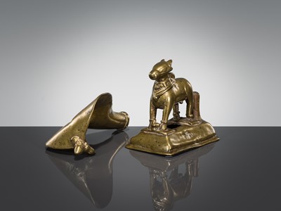 Lot 289 - A BRASS FIGURE OF NANDI CANOPIED BY A CROWNED NAGA, INDIA, 17TH CENTURY