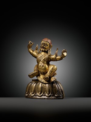Lot 19 - A GILT-BRONZE FIGURE OF GARWA NAGPO DAMCHEN, TIBET, 17TH-18TH CENTURY