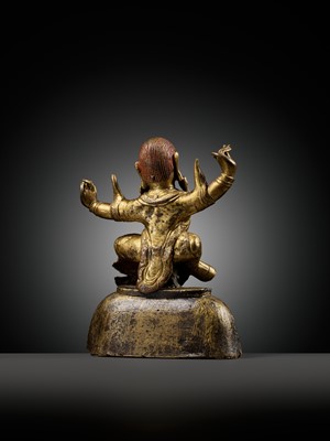 Lot 19 - A GILT-BRONZE FIGURE OF GARWA NAGPO DAMCHEN, TIBET, 17TH-18TH CENTURY