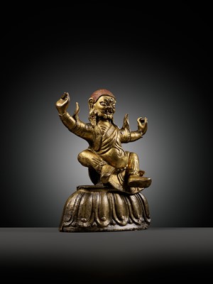 Lot 19 - A GILT-BRONZE FIGURE OF GARWA NAGPO DAMCHEN, TIBET, 17TH-18TH CENTURY