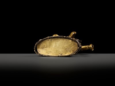Lot 19 - A GILT-BRONZE FIGURE OF GARWA NAGPO DAMCHEN, TIBET, 17TH-18TH CENTURY