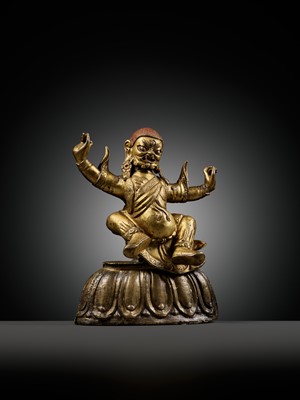 Lot 19 - A GILT-BRONZE FIGURE OF GARWA NAGPO DAMCHEN, TIBET, 17TH-18TH CENTURY