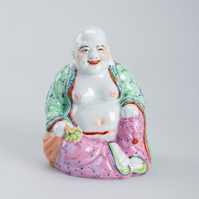 AN ENAMELED PORCELAIN FIGURE OF BUDAI