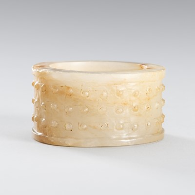 Lot 963 - AN ARCHAISTIC WHITE AND RUSSET JADE ORNAMENT, QING DYNASTY