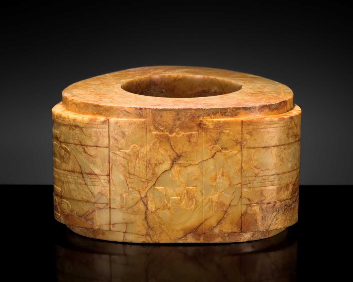 AN UNUSUALLY LARGE AND MASSIVE (15.9 KG) LIANGZHU-STYLE FOUR-TIERED YELLOW-RUSSET JADE CONG