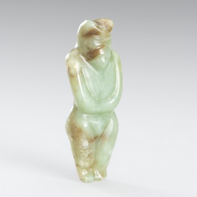 Lot 918 - A PALE CELADON AND BROWN JADE ‘SUN GOD’ PENDANT, HONGSHAN CULTURE