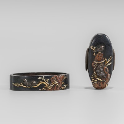 Lot 1940 - A SHAKUDO FUCHI AND KASHIRA WITH BIRDS ON A GNARLED TRUNK