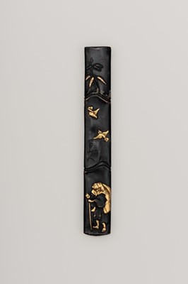 Lot 1633 - A PATINATED KOZUKA WITH AN ELDERLY WANDERSMAN AND SPARROWS