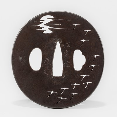 Lot 606 - ITO MITSUTOSHI: A FINE IRON SUKASHI TSUBA DEPICTING DESCENDING GEESE FLYING AT NIGHT