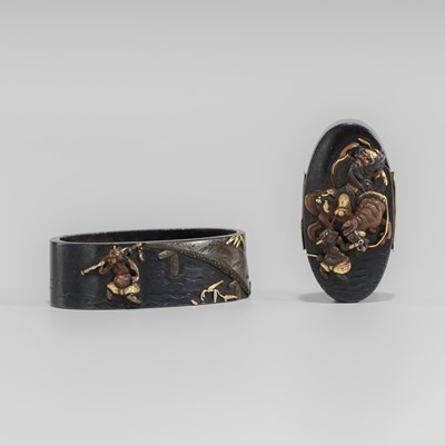 Lot 581 - A FINE HAMANO SCHOOL SHAKUDO FUCHI AND KASHIRA WITH SHOKI AND ONI