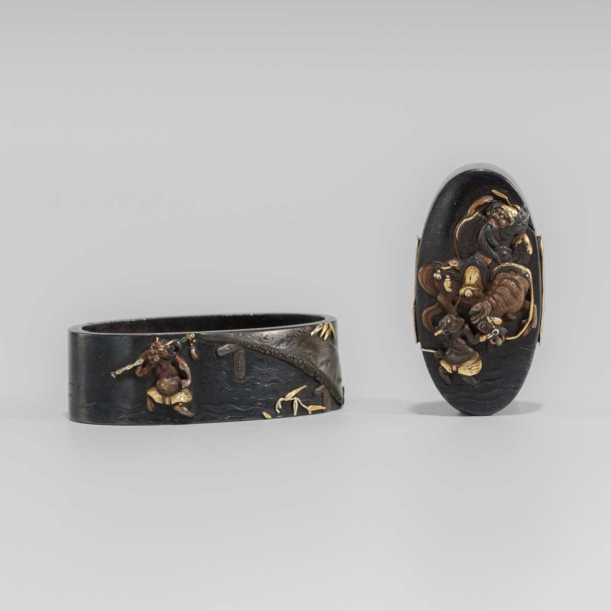 Lot 581 - A FINE HAMANO SCHOOL SHAKUDO FUCHI AND KASHIRA WITH SHOKI AND ONI