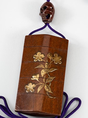 Lot 250 - A SIGNED FOUR-CASE LACQUER AND WOOD INRO DEPICTING CHERRY SPRAYS