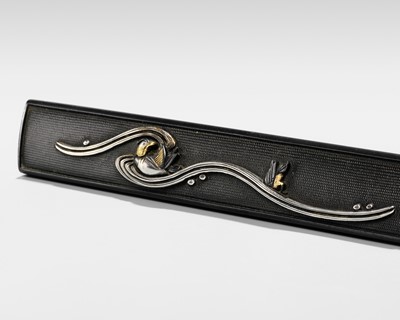 Lot 84 - A SHAKUDO KOZUKA WITH TWO MANDARIN DUCKS (OSHIDORI) IN WAVES