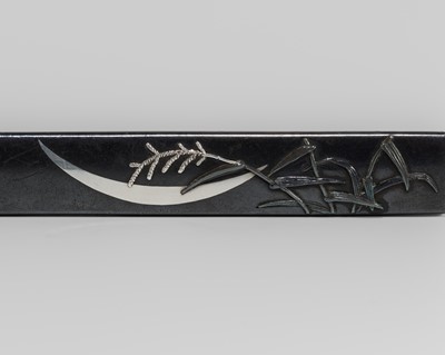 Lot 576 - A SHAKUDO KOZUKA WITH THE CRESCENT MOON AND WATER REEDS