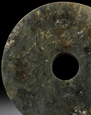 Lot 430 - A SPINACH GREEN JADE DISC, BI, NEOLITHIC PERIOD, 3RD MILLENNIUM BC