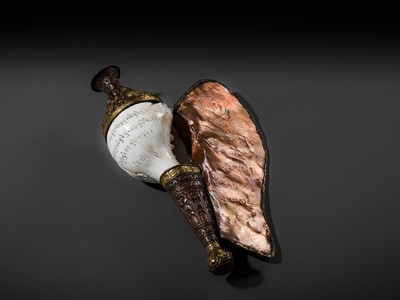 Lot 29 - A CARVED CONCH-SHELL TRUMPET, DUNG DKAR, WITH PARCEL-GILT COPPER REPOUSSÉ MOUNT