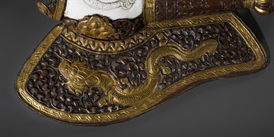 Lot 29 - A CARVED CONCH-SHELL TRUMPET, DUNG DKAR, WITH PARCEL-GILT COPPER REPOUSSÉ MOUNT