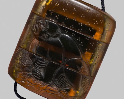 Lot 423 - A VERY RARE AMBER TWO-CASE INRO DEPICTING JIRAIYA TRANSFORMED INTO A TOAD