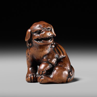 Lot 75 - A GOOD WOOD NETSUKE OF A SHISHI