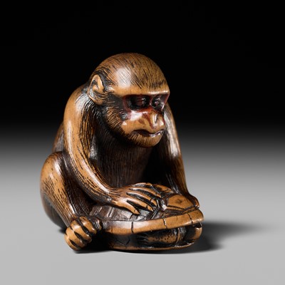 Lot 93 - A GOOD KYOTO SCHOOL WOOD NETSUKE OF A MONKEY WITH A TORTOISE