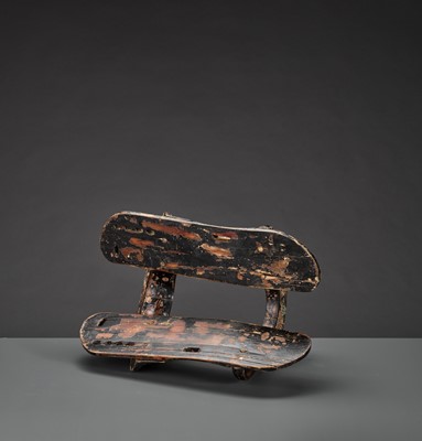 A RARE LIAO DYNASTY LACQUERED WOOD SADDLE WITH GILT COPPER APPLICATIONS