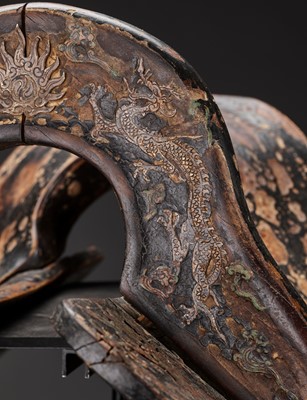 A RARE LIAO DYNASTY LACQUERED WOOD SADDLE WITH GILT COPPER APPLICATIONS