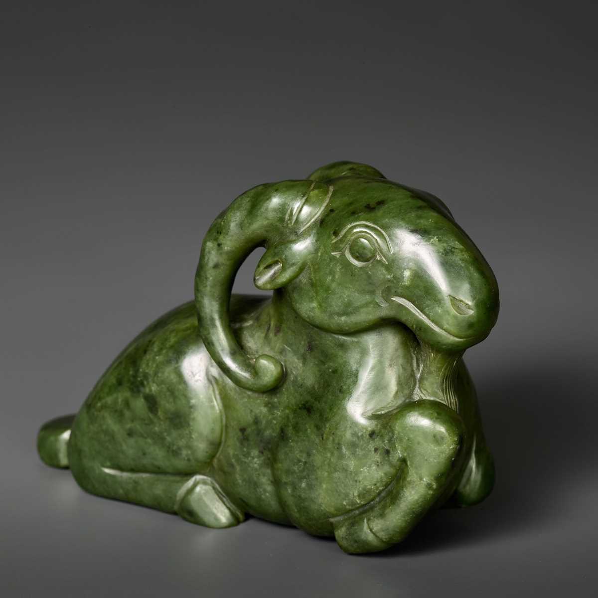 Lot 167 - A MASSIVE SPINACH GREEN JADE MODEL OF A RECUMBENT RAM, QING DYNASTY