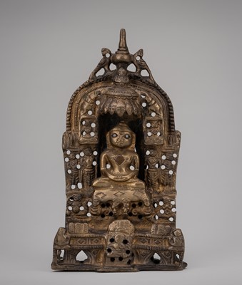 Lot 988 - A JAIN COPPER AND SILVER-INLAID BRASS SHRINE OF PARSHVANATHA