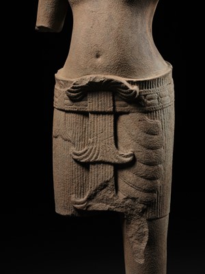 Lot 260 - A SANDSTONE FIGURE OF VISHNU, ANGKOR PERIOD, ANGKOR WAT STYLE