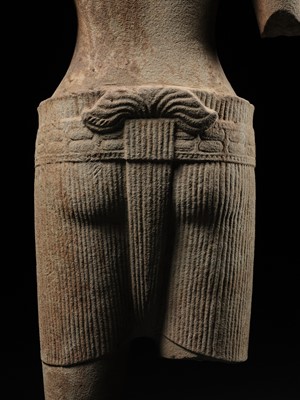 Lot 260 - A SANDSTONE FIGURE OF VISHNU, ANGKOR PERIOD, ANGKOR WAT STYLE