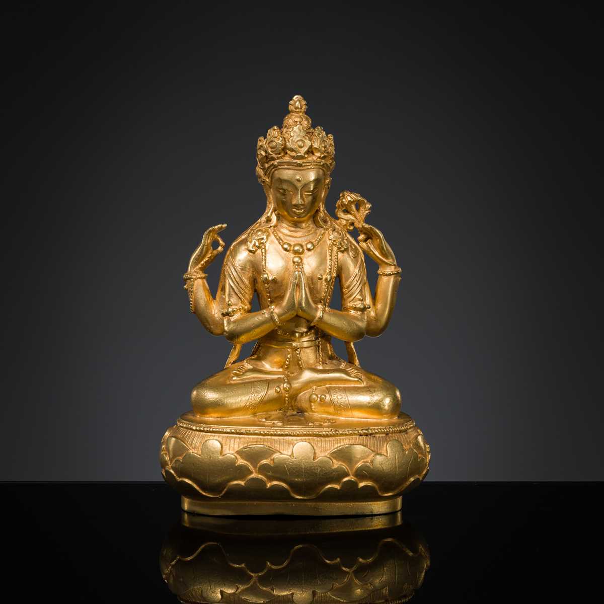 Lot 62 - A GILT-BRONZE FIGURE OF SHADAKSHARI AVALOKITESHVARA, ZANABAZAR SCHOOL