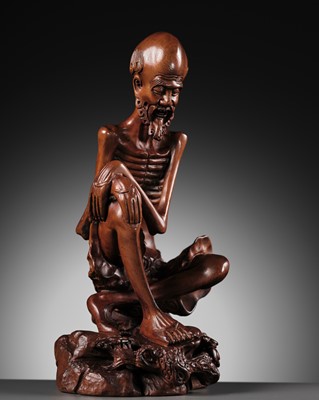 Lot 355 - A BOXWOOD FIGURE OF AN EMACIATED LUOHAN, QING DYNASTY