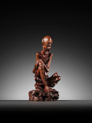 Lot 355 - A BOXWOOD FIGURE OF AN EMACIATED LUOHAN, QING DYNASTY