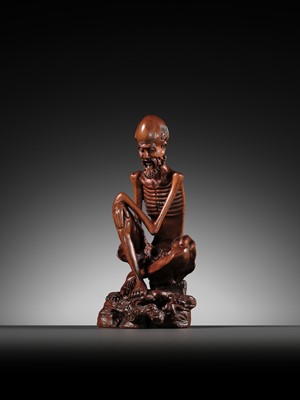 Lot 355 - A BOXWOOD FIGURE OF AN EMACIATED LUOHAN, QING DYNASTY