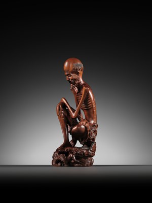 Lot 355 - A BOXWOOD FIGURE OF AN EMACIATED LUOHAN, QING DYNASTY