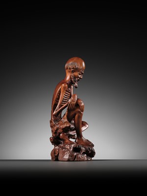 Lot 355 - A BOXWOOD FIGURE OF AN EMACIATED LUOHAN, QING DYNASTY