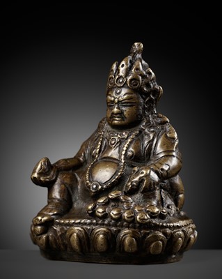 Lot 282 - A SILVER AND COPPER INLAID BRONZE FIGURE OF JAMBHALA, TIBET, 15TH-16TH CENTURY