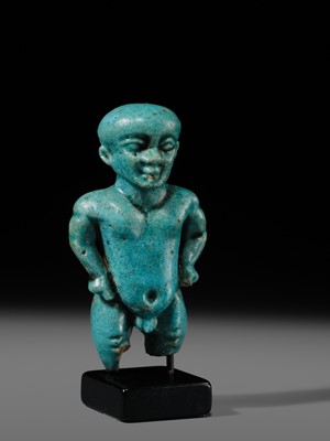 Lot 45 - A TURQUOISE-GLAZED FAIENCE AMULET OF PATAIKOS, LATE PERIOD