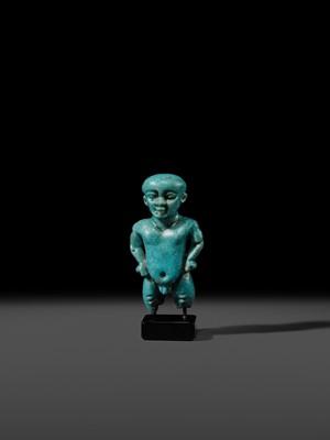 Lot 45 - A TURQUOISE-GLAZED FAIENCE AMULET OF PATAIKOS, LATE PERIOD