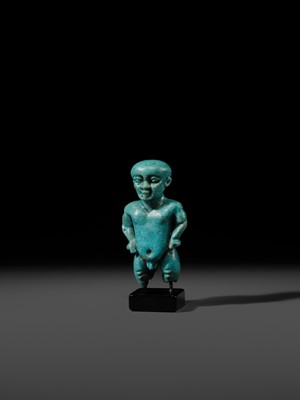 Lot 45 - A TURQUOISE-GLAZED FAIENCE AMULET OF PATAIKOS, LATE PERIOD