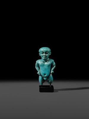 Lot 45 - A TURQUOISE-GLAZED FAIENCE AMULET OF PATAIKOS, LATE PERIOD