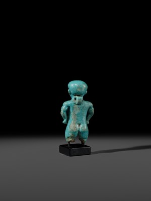 Lot 45 - A TURQUOISE-GLAZED FAIENCE AMULET OF PATAIKOS, LATE PERIOD