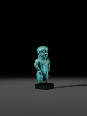 Lot 45 - A TURQUOISE-GLAZED FAIENCE AMULET OF PATAIKOS, LATE PERIOD