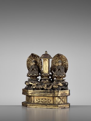 Lot 153 - A GOLD LACQUERED SHRINE WITH TWO SEATED BUDDHAS FLANKING A BUDDHIST STELE, LATE EDO