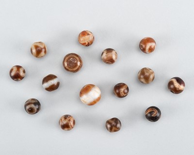 Lot 1539 - A GROUP OF 15 ETCHED AGATE BEADS, 19TH CENTURY OR EARLIER