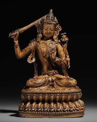 Lot 47 - A RARE EARLY-MING GILT-BRONZE FIGURE OF MANJUSHRI, YONGLE INCISED SIX-CHARACTER MARK AND OF THE PERIOD